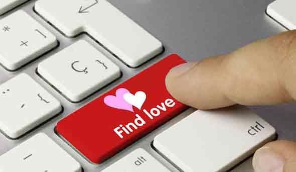  A keyboard with a “finding love” sign in the Enter key.