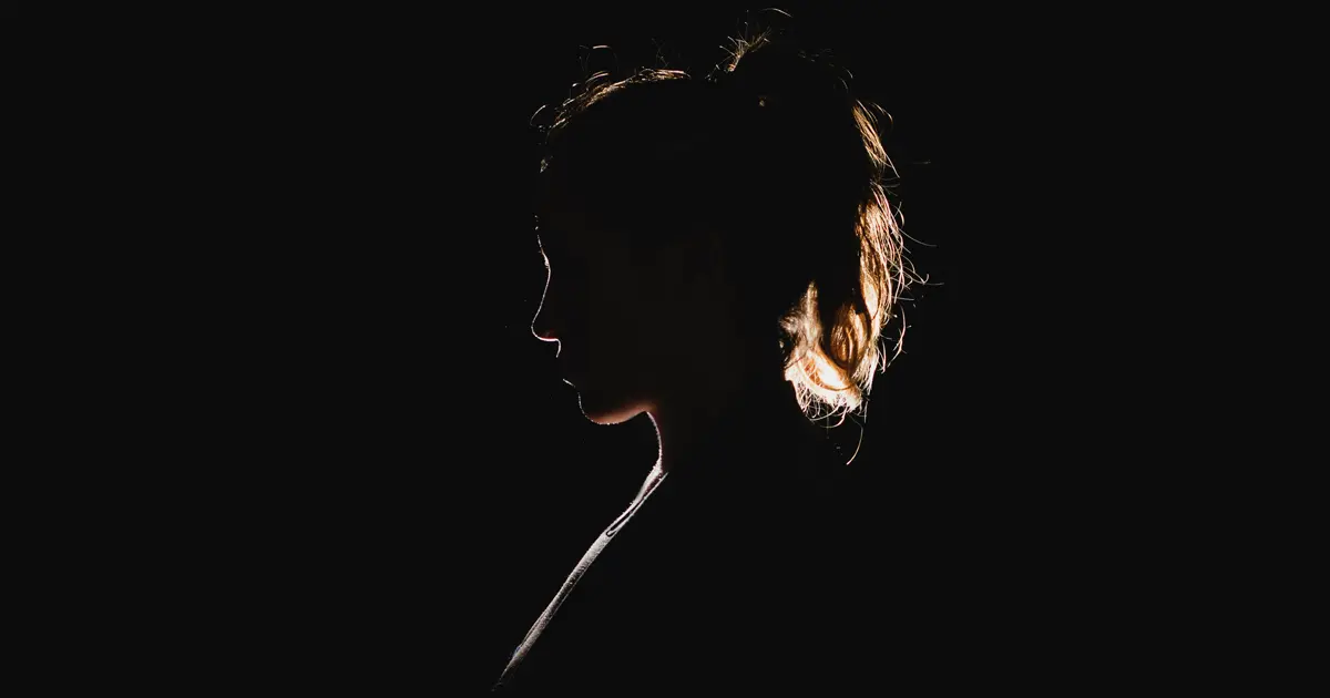 A black silhouette of a woman